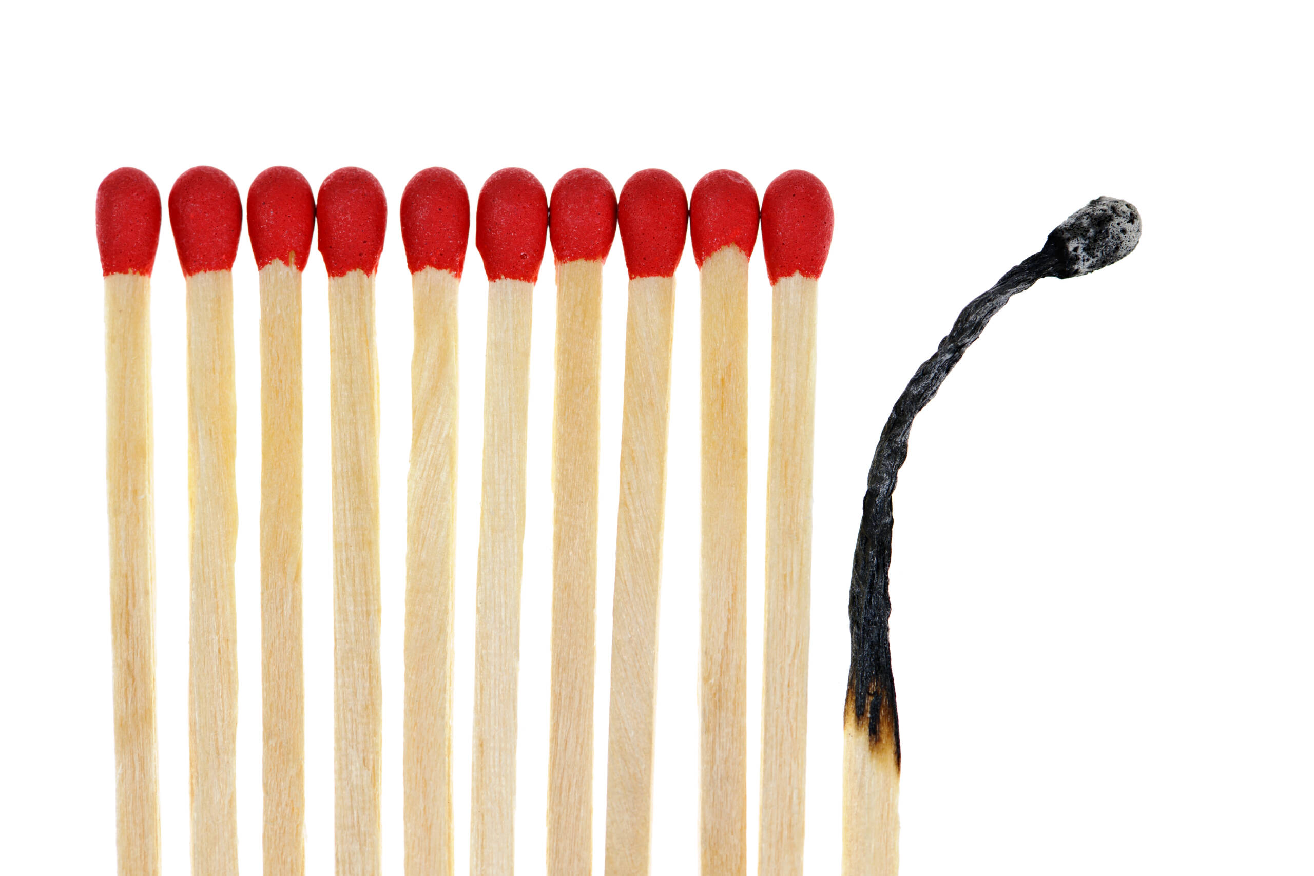 Row of matches with one match burned